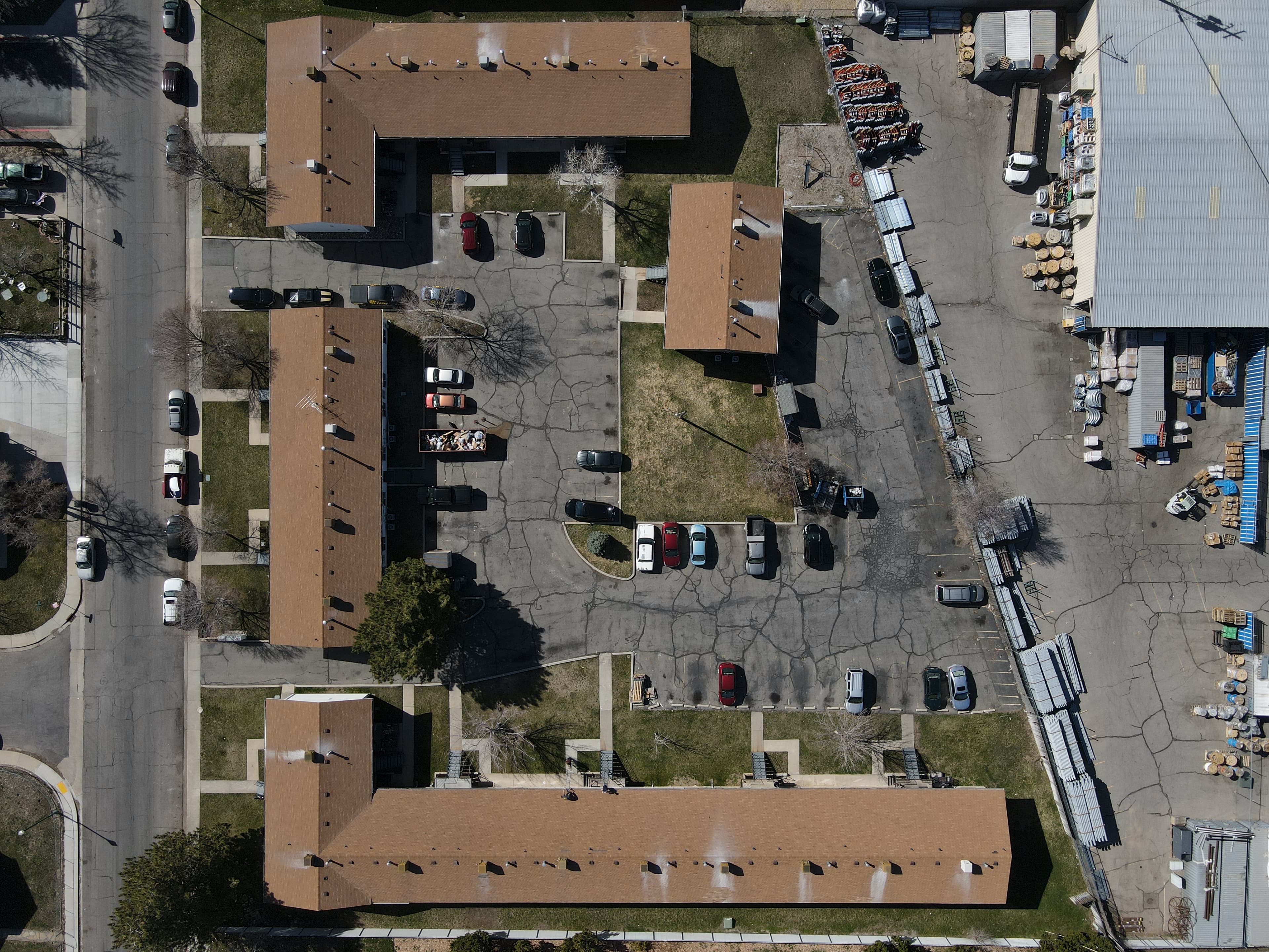 Mid-installation roof with underlayment visible, aerial view