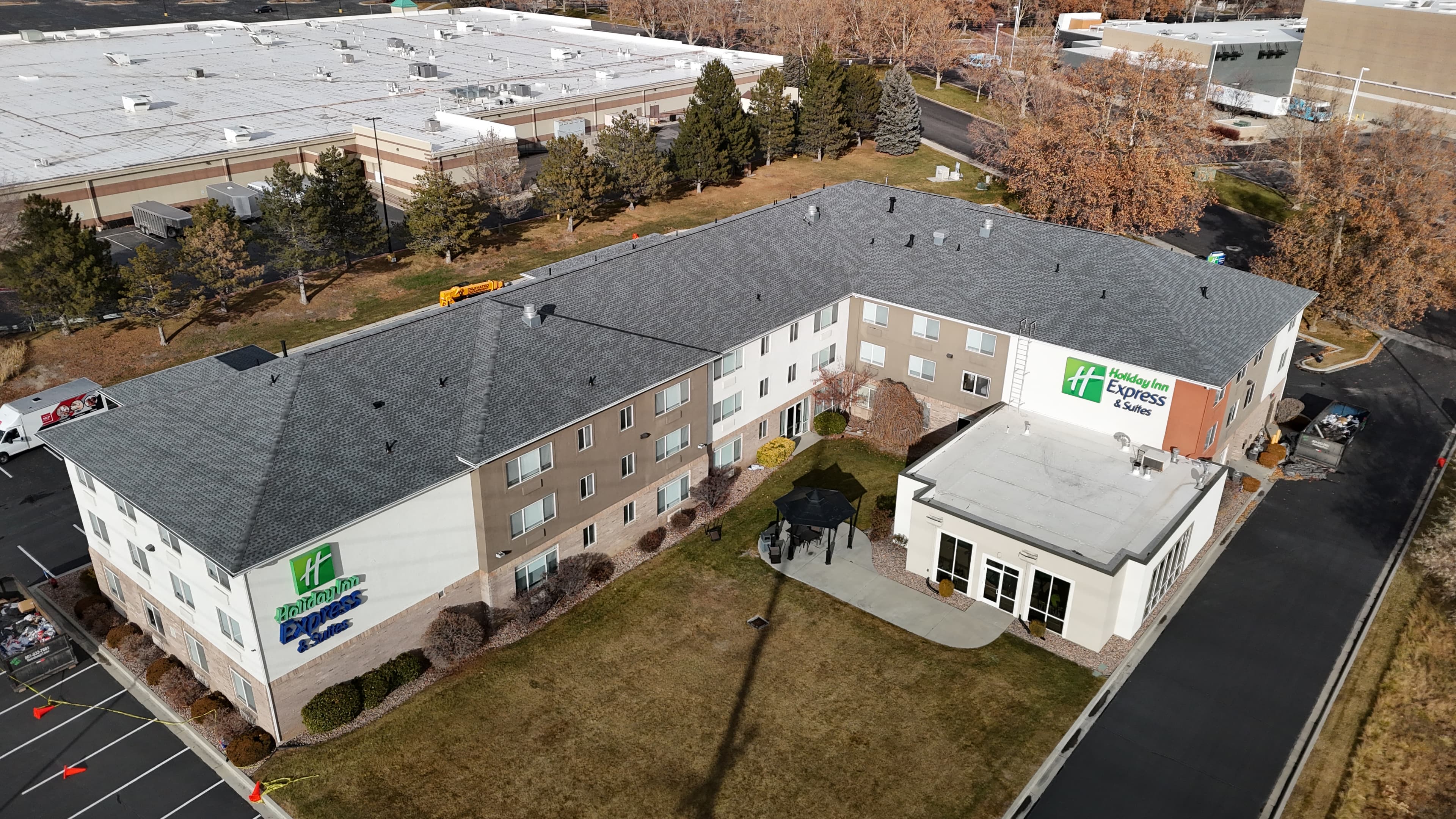 New roof installation on two-story home, drone photo