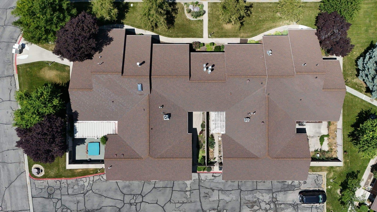 Overhead drone view of a Grandview Farm building before replacement, June 2025
