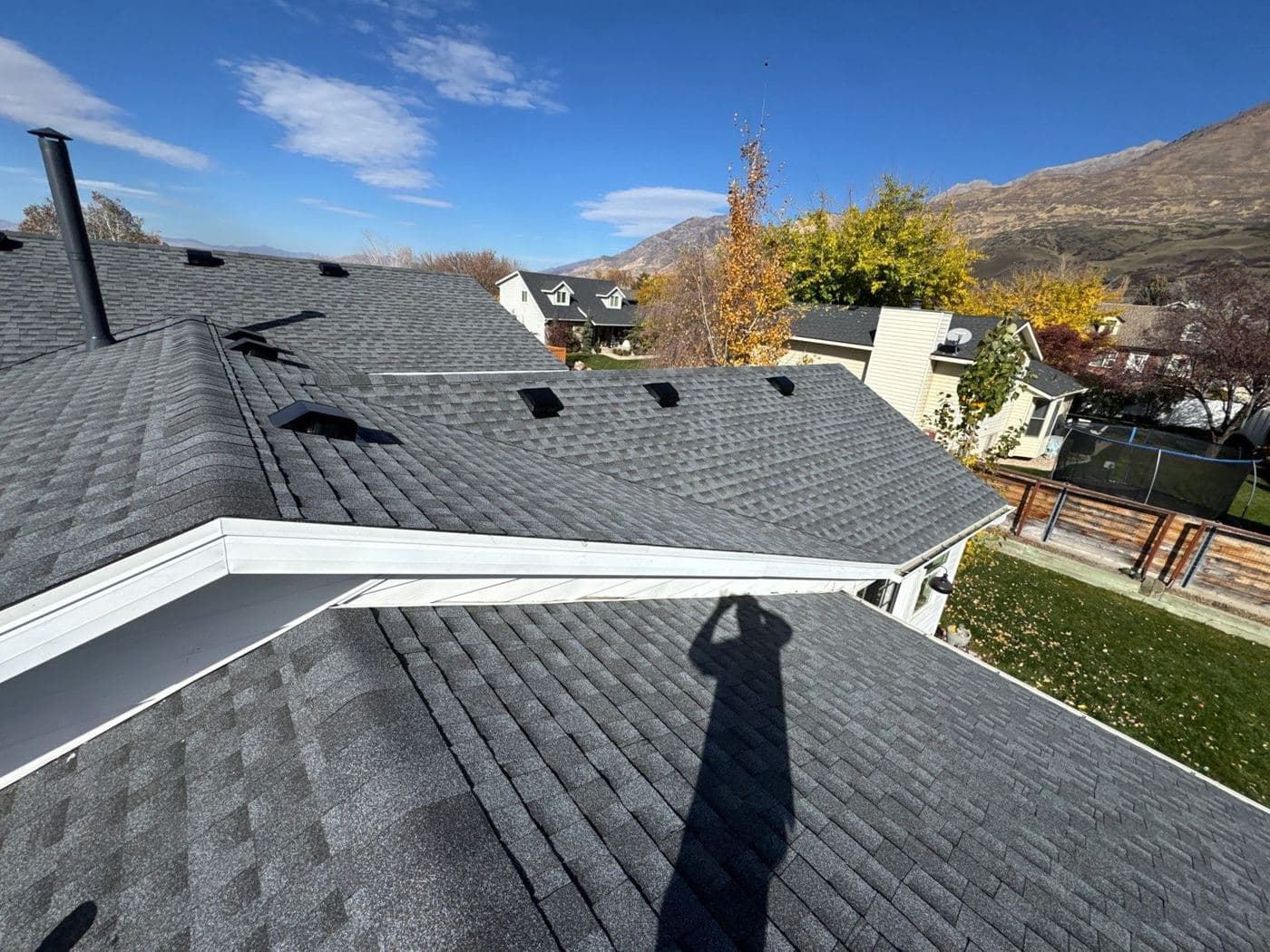 Finished back slopes of an Orem roof with new turtle vents and GAF Timberline HDZ shingles