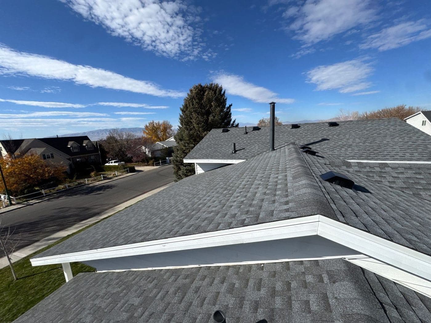New GAF Timberline HDZ shingles in Pewter Gray along the ridge of an Orem home after wind damage
