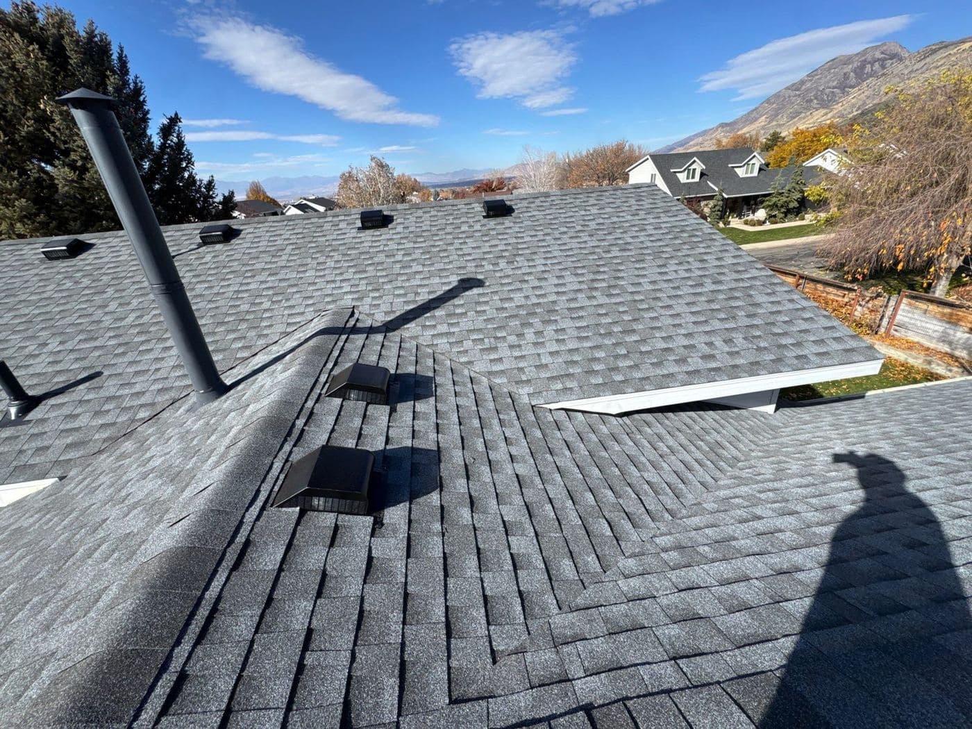 Shingled valley and turtle vents on a replaced Orem roof